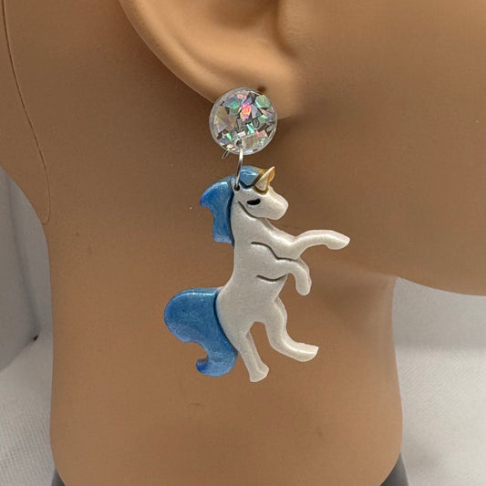 Mannequin head with a decorative earring on a white background